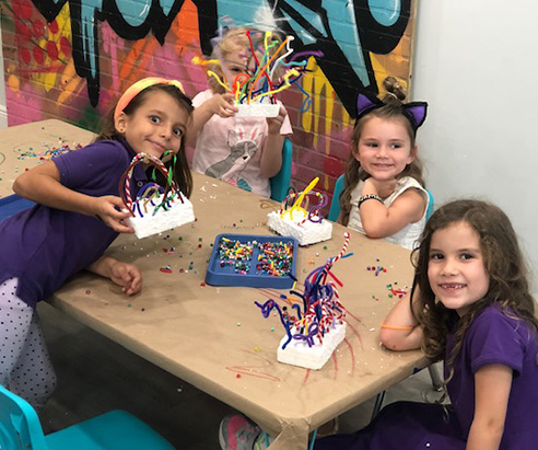 Children painting in Artnest Studio class