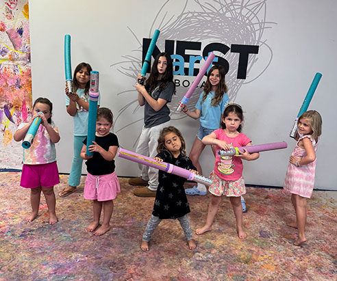 Children painting in Artnest Studio class